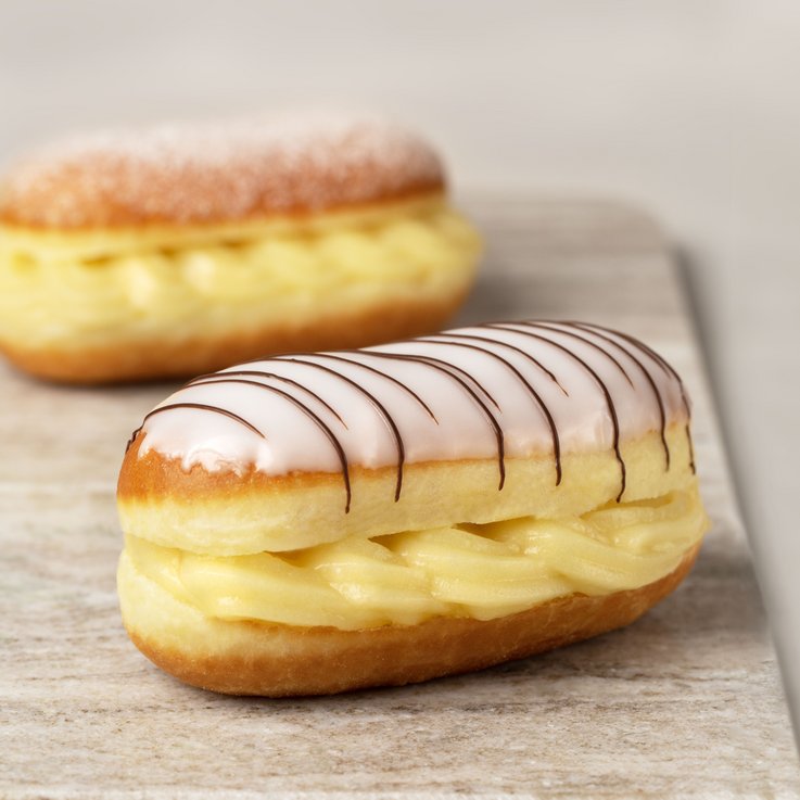 Vanilla-filled doughnut pastry with sugar icing.